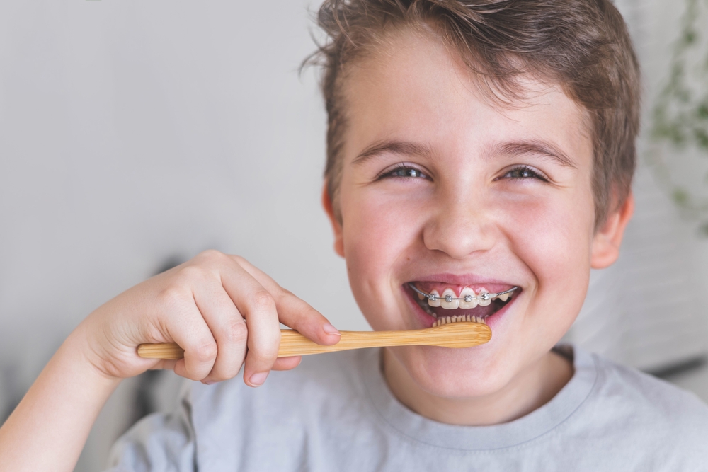 young brushing his teeth