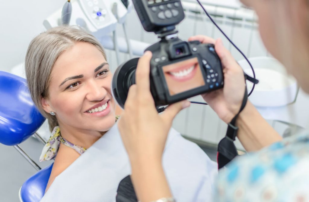 taking a photo of a patient's new smile