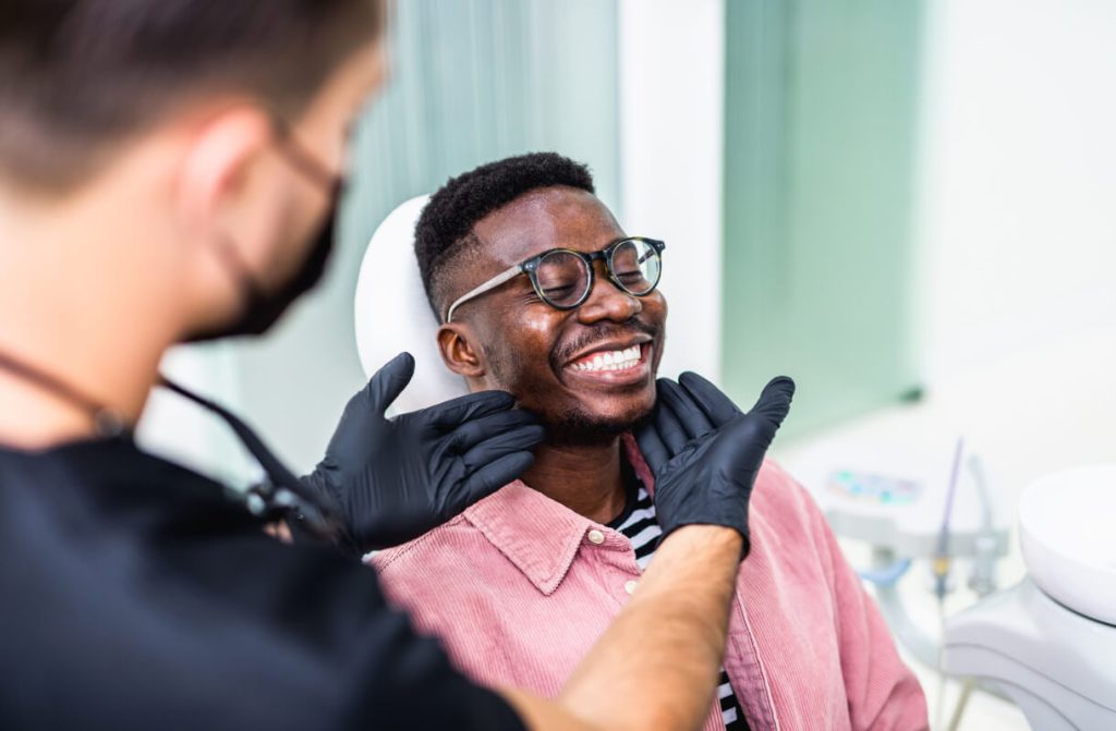 man smiling at the dentist
